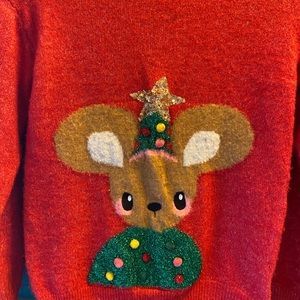 A size 8/10 Christmas sweater. An adorable little mouse with a tree shirt & hat